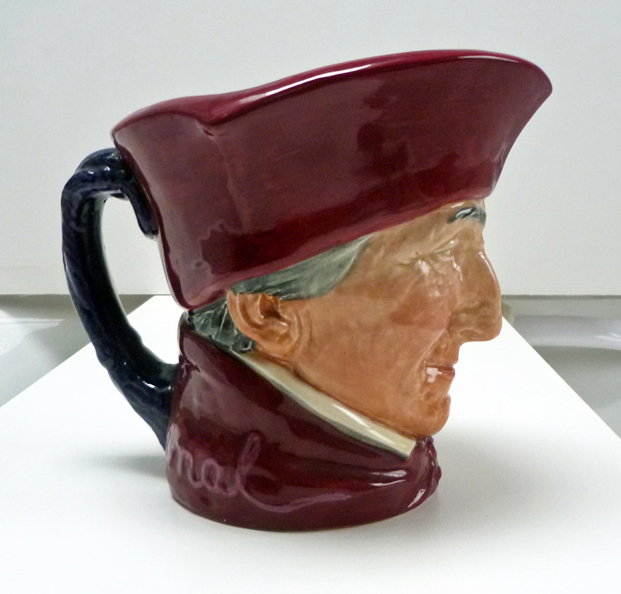 Right side of a large Royal Doulton Cardinal jug.