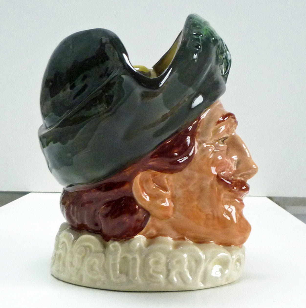 Right side of a figure head of a large Royal Doulton Cavalier jug.