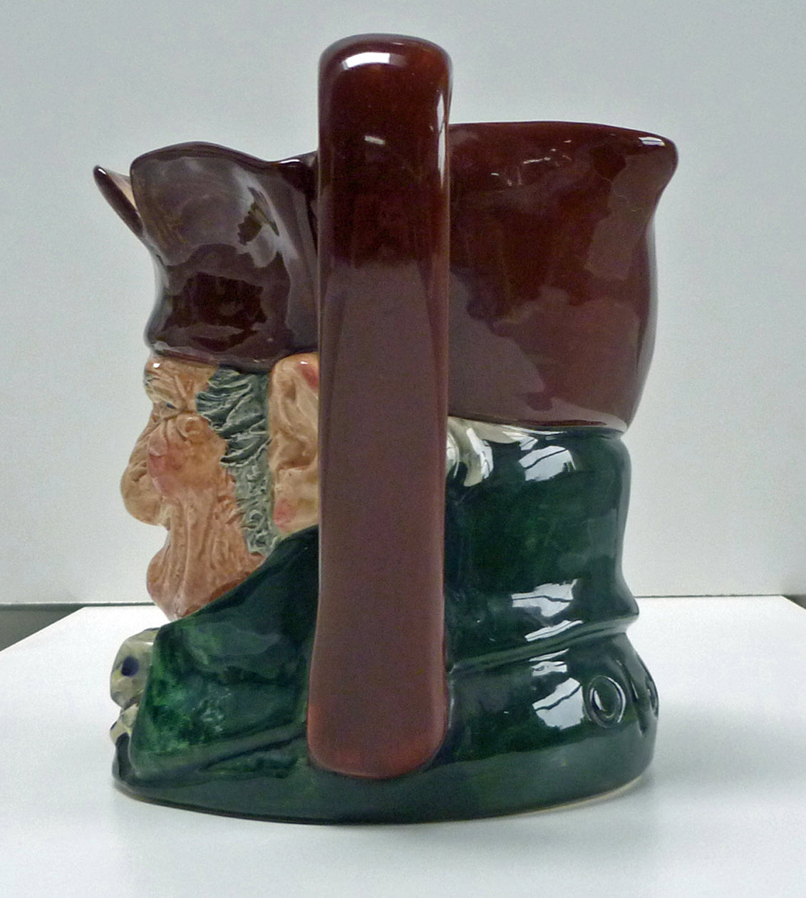 Left side of head and handle of a large Royal Doulton Old Charley jug.