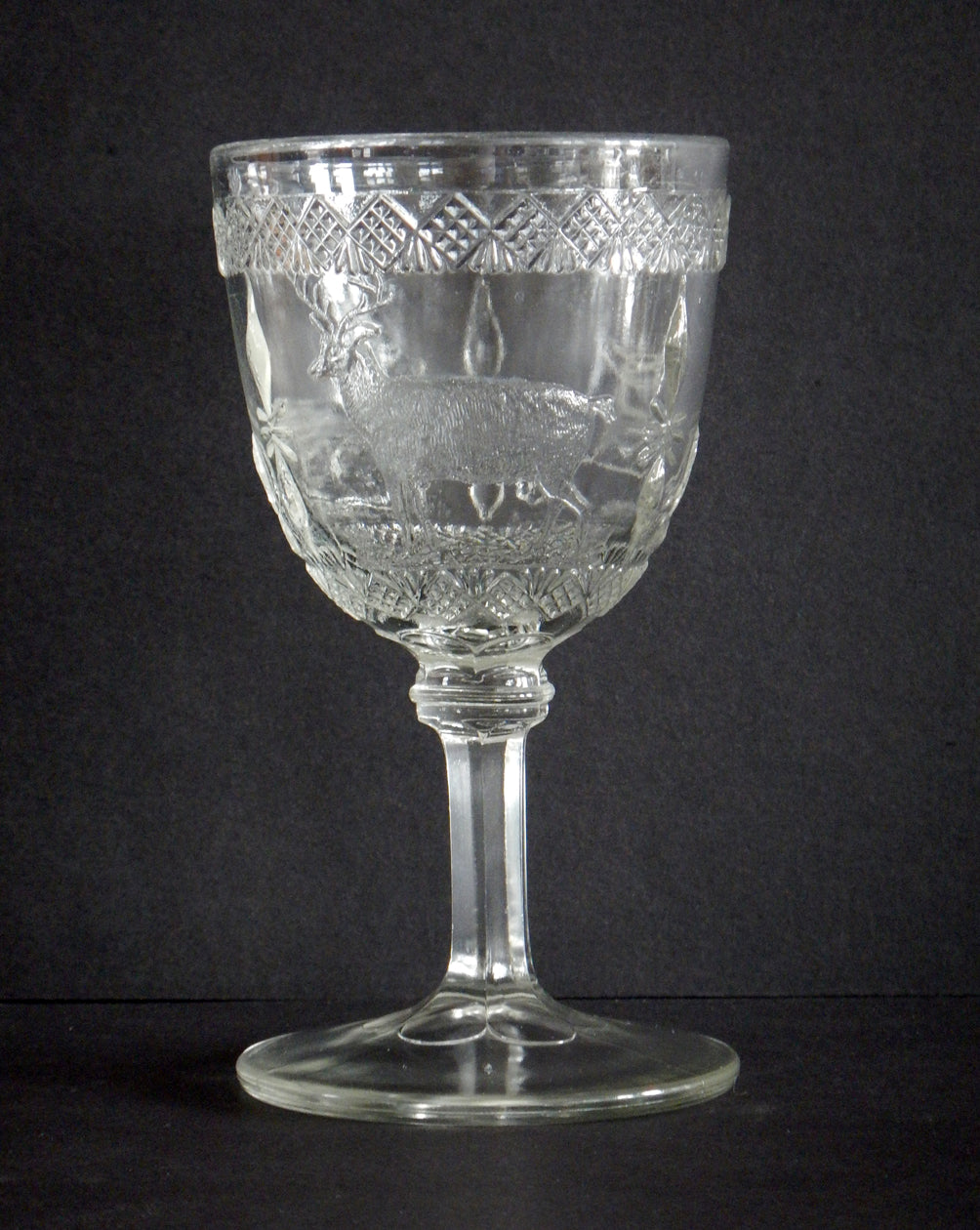 Close-up of an elk on an Elk and Doe pattern goblet.
