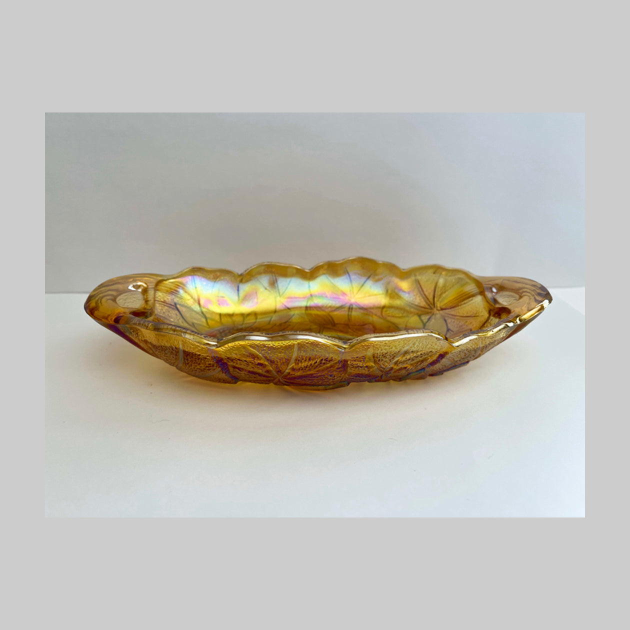 Vintage Carnival glass dish, iridescent gold, Lily Pons or pads in the pattern.