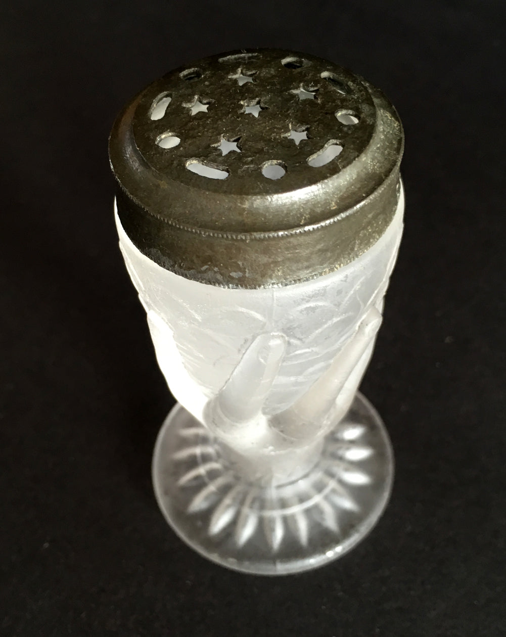 Close-up showing the lid design with stars on a frosted glass salt shaker.