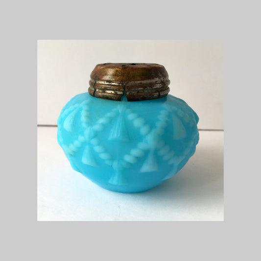 Antique, blue pressed milk glass salt shaker with Cord and Tassel pattern design.