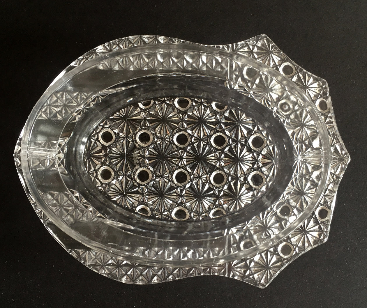 Overview of clear pressed glass butter dish in Banner pattern. 