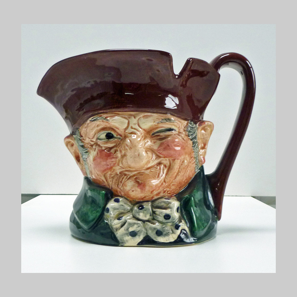 Royal Doulton large character jug of a squinting Old Charley figure and bowtie. 