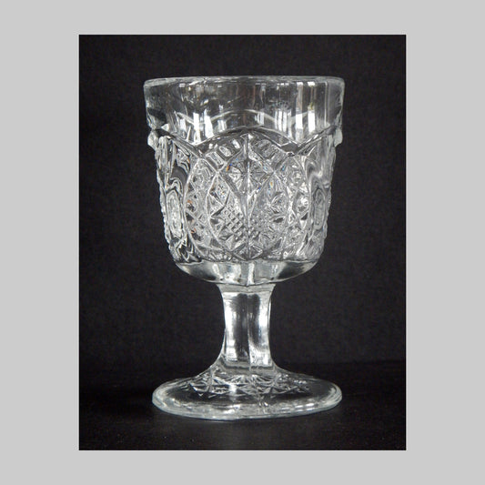 Antique clear pressed glass cordial in Arrowhead and Oval pattern and details.