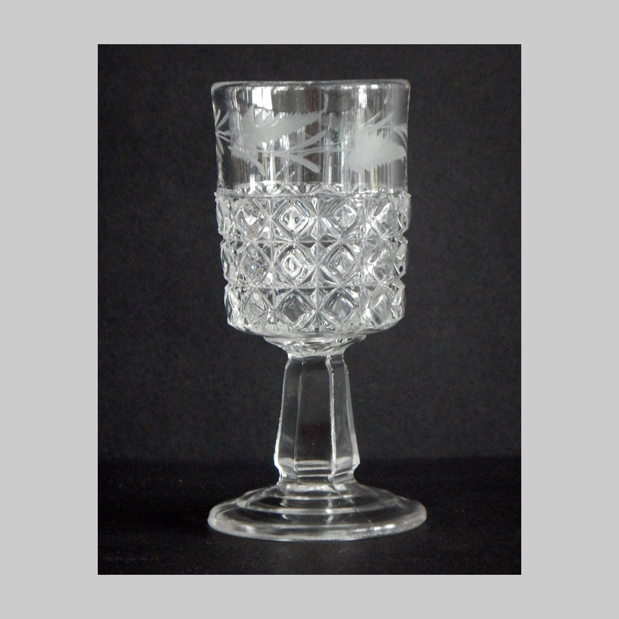 Antique pressed glass cordial with etched fern in Mascotte pattern.