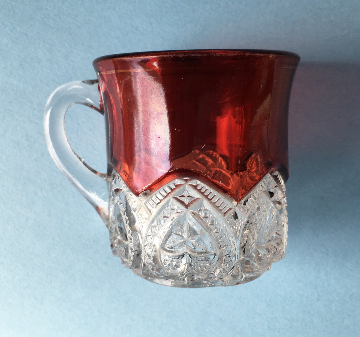 Other side of a souvenir mug, Heart Band pattern, with clear and ruby glass.