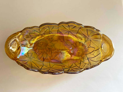 Looking from above a vintage pickle dish, Carnival glass, in Lily Pons pattern.