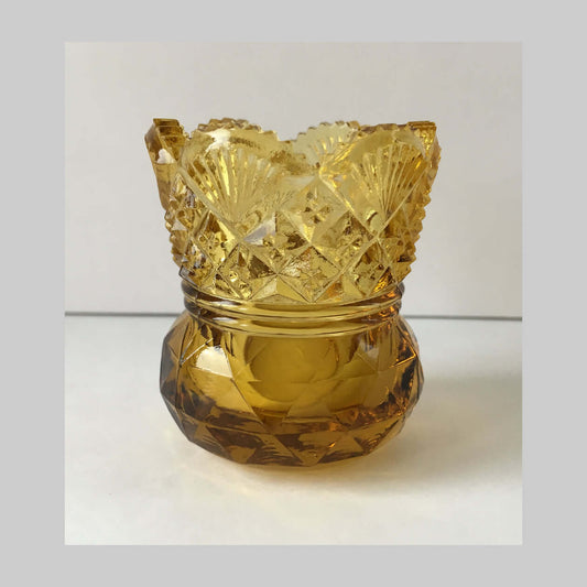 Antique amber pressed glass toothpick holder in Westmoreland sixty pattern.