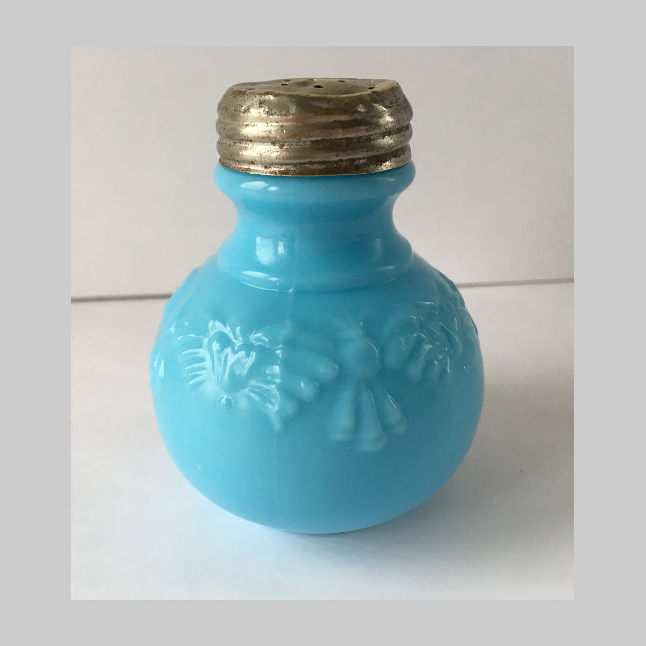 EAPG Butterfly and Tassel pattern blue milk glass salt shaker main image